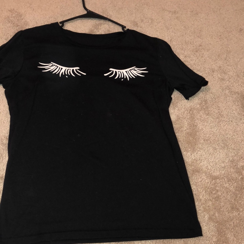Super cute black shirt with eyelashes